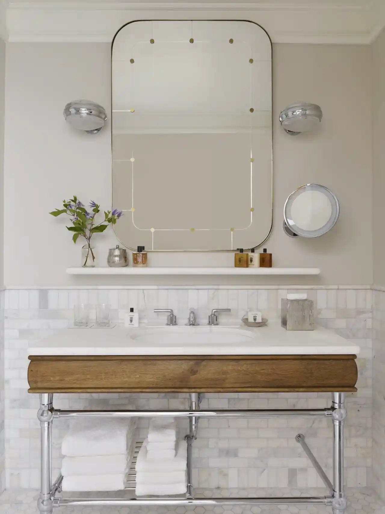 A large size mirror just hanging above the wash basin