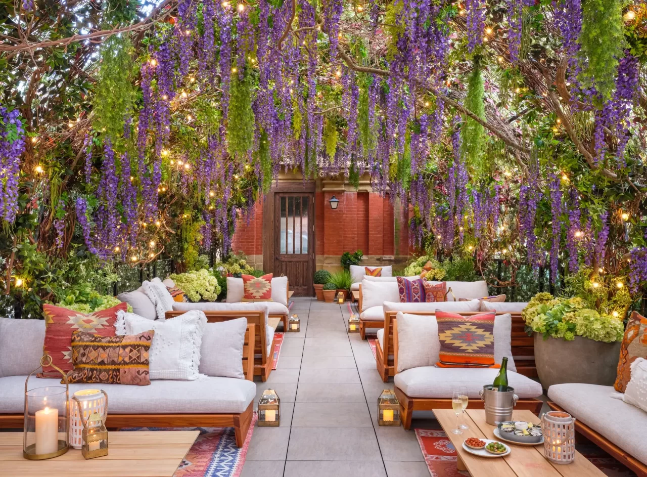 Beautifully decorated terrace with flowers and some sofa are lying on the terrace