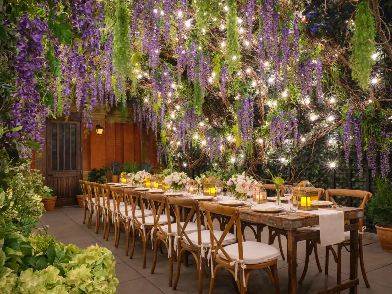 Well-decorated long dining table at the rooftop of The Beekman Hotel