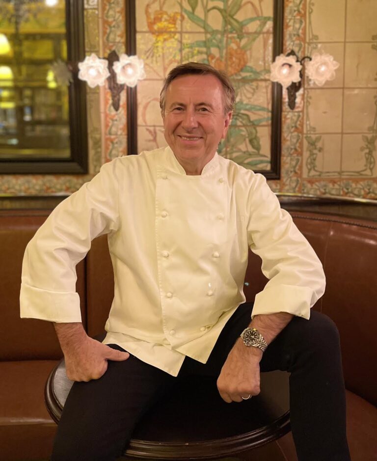 Chef Daniel Boulud siting in a chair and introducing his newest restaurant Le Gratin