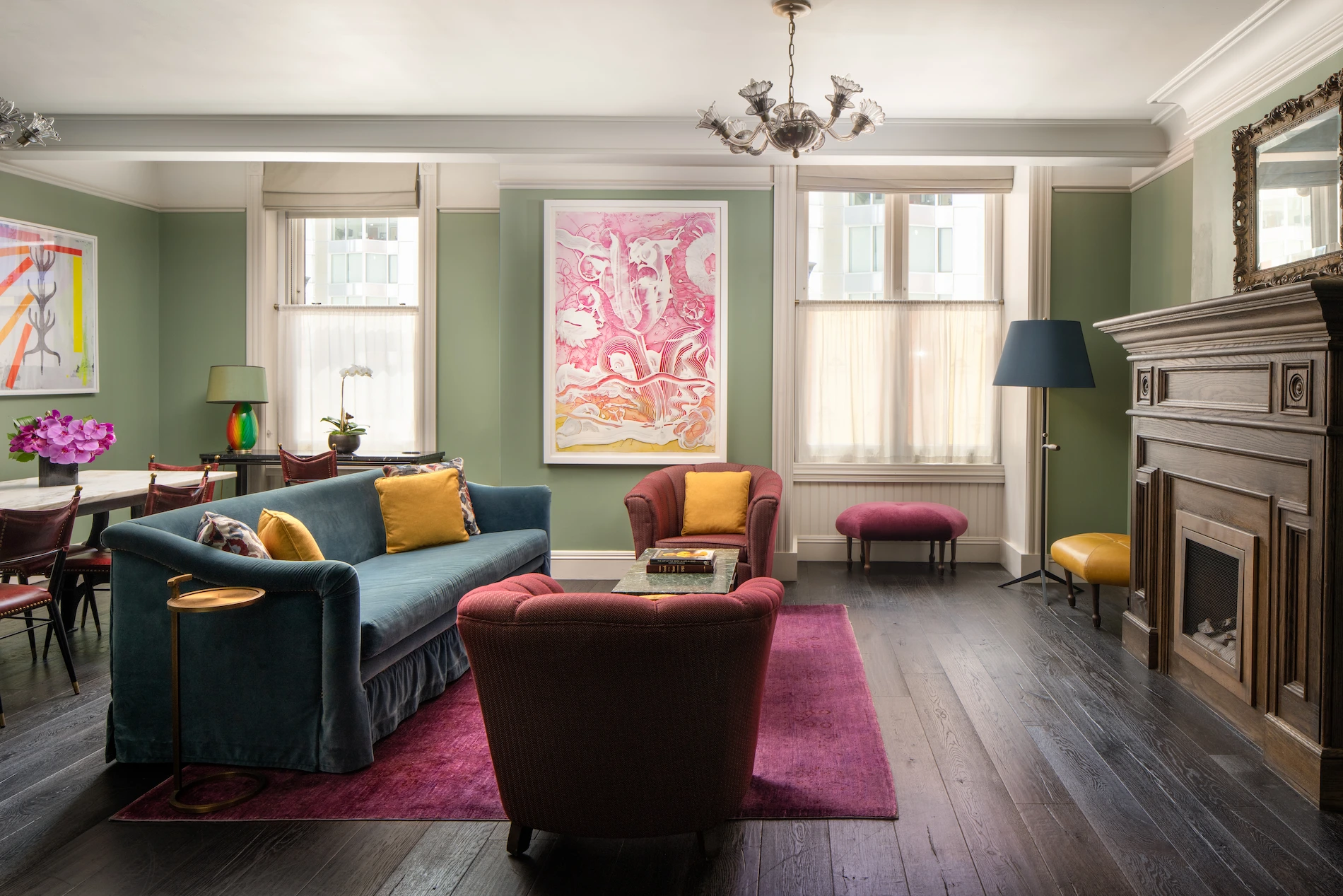 Cozy lounge at The Beekman Hotel with elegant sofas, armchairs, and a classic fireplace.